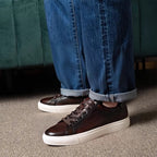Men's dark brown leather lace-up sneakers with white rubber sole