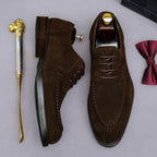 Men's brown wingtip brogue Oxford shoes with chunky lug sole and lace-up