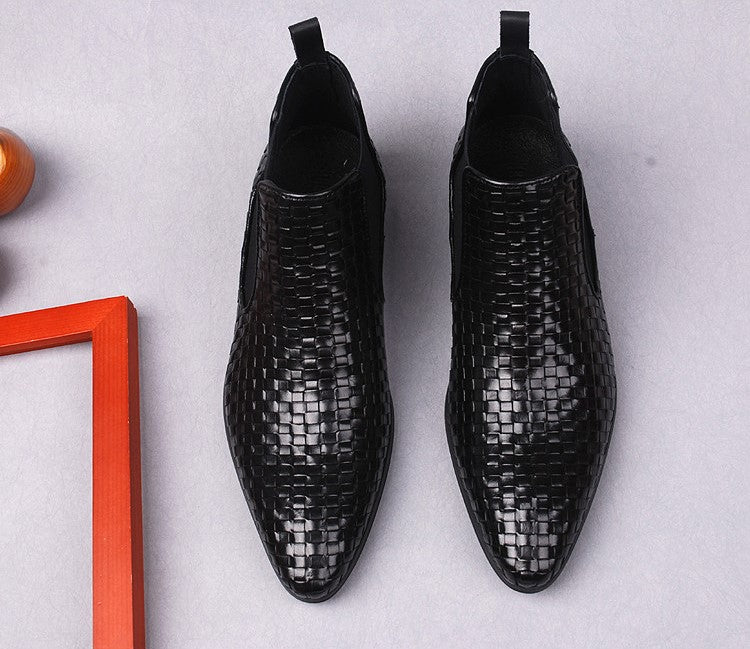 Black leather formal dress boots with woven finish and side zipper, front view pair