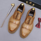 Men's chunky lug-sole wingtip brogue oxfords in tan leather, lace-up with perforated toe