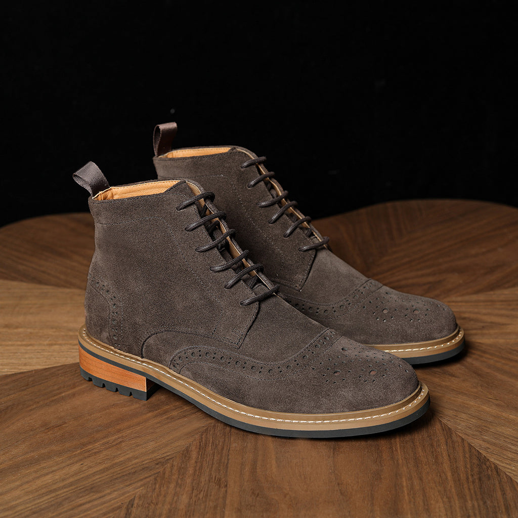Men's dark gray suede chukka boots with lace-up closure and perforated side panels