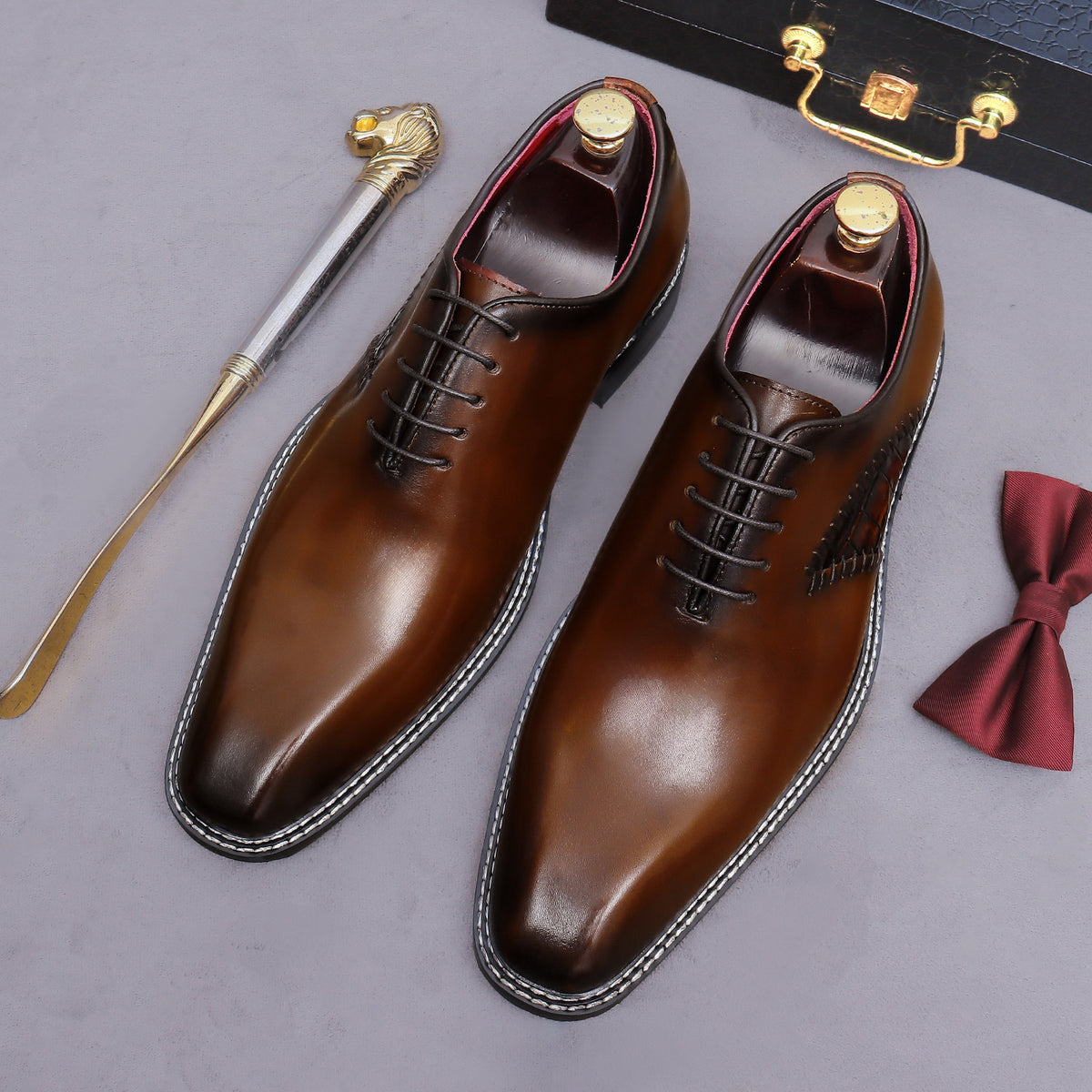 Dark brown wingtip brogue oxford shoes with chunky lug sole and lace-up design