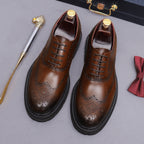 Men's chunky lug sole wingtip brogue oxfords, dark brown pair, lace-up with wingtip detailing