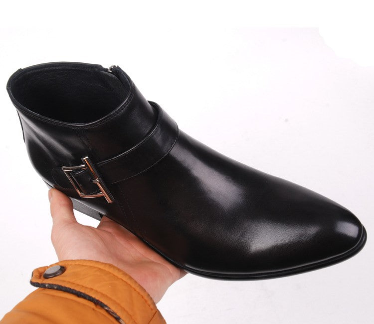 Men's black leather side-zip dress boots with buckle strap and thick sole.