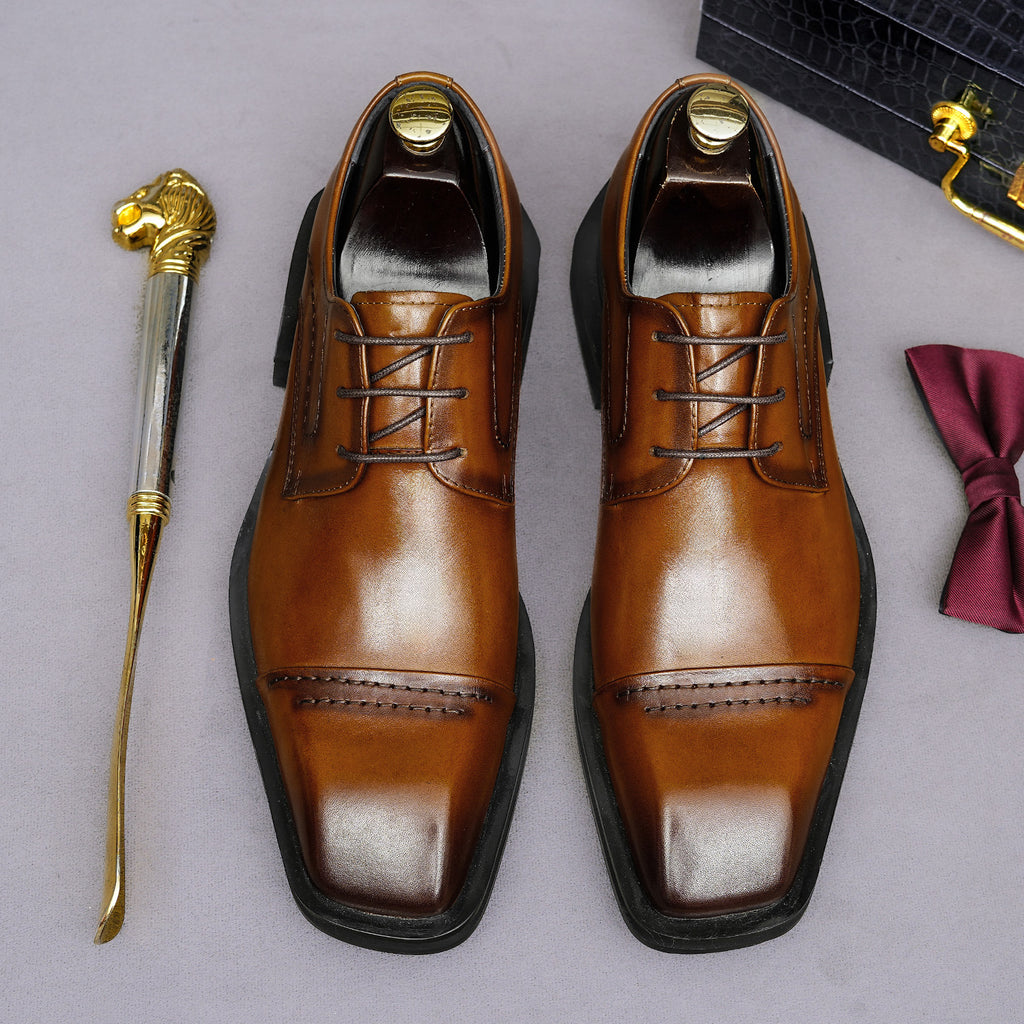 Men's brown leather lace-up derby dress shoes, pointed toe with detailed stitching.