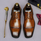 Men's brown leather lace-up derby dress shoes, pointed toe with detailed stitching.