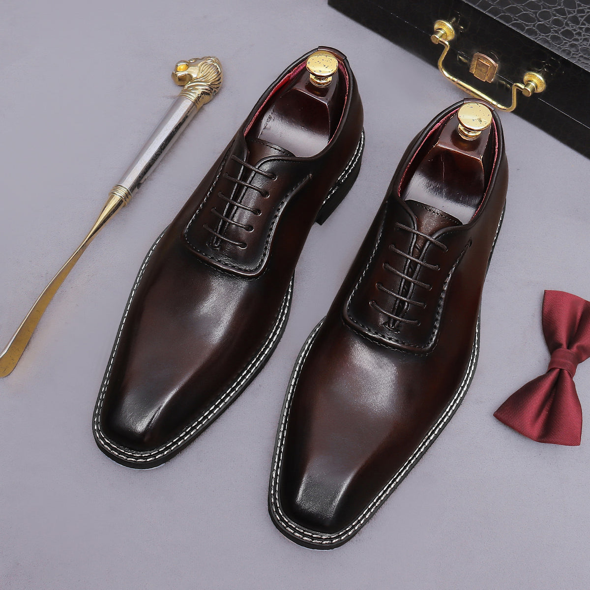 Men's chunky lug sole wingtip brogue oxford shoes in dark brown, lace-up profile view.