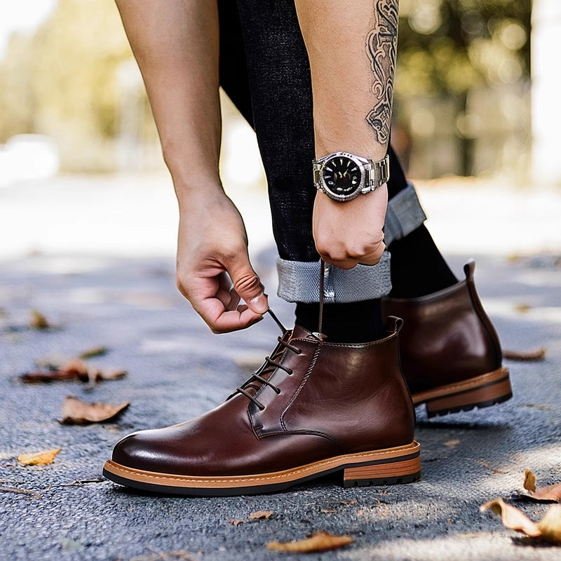 Dark brown leather lace-up chukka boot close-up, plain toe and lace-up vamp.