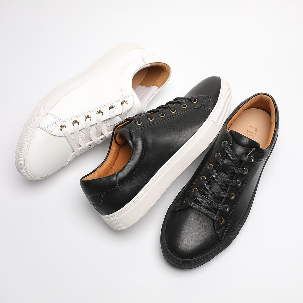 Set of men's leather sneakers in black and white, lace-up low-tops with cupsoles
