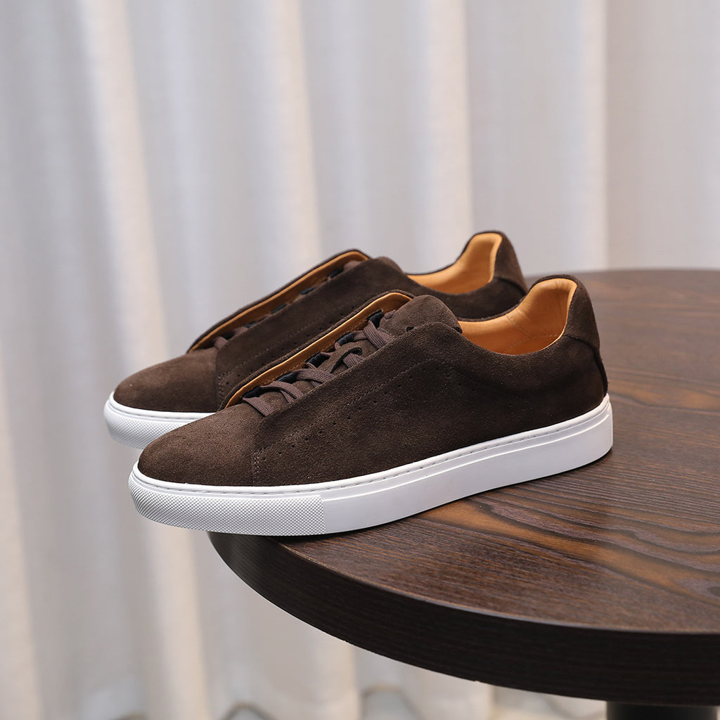 Men's brown suede leather sneakers with lace-up front and white rubber sole