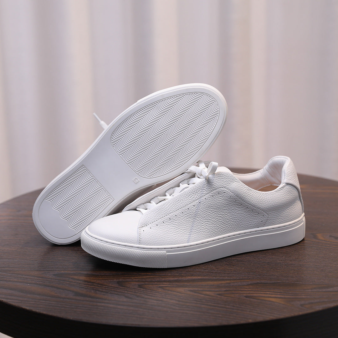 Men's genuine leather sneakers, white outsole and toe view with textured tread