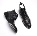Black lace-up dress boots, glossy finish with wingtip pattern and low heel