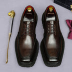 Men's chunky lug-sole wingtip brogue oxford shoes, dark brown, lace-up front view.