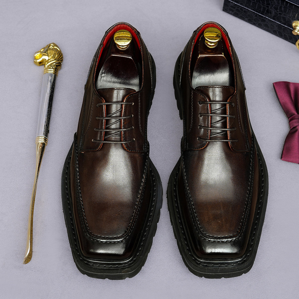 Men's chunky lug-sole wingtip brogue oxford shoes, dark brown, lace-up front view.