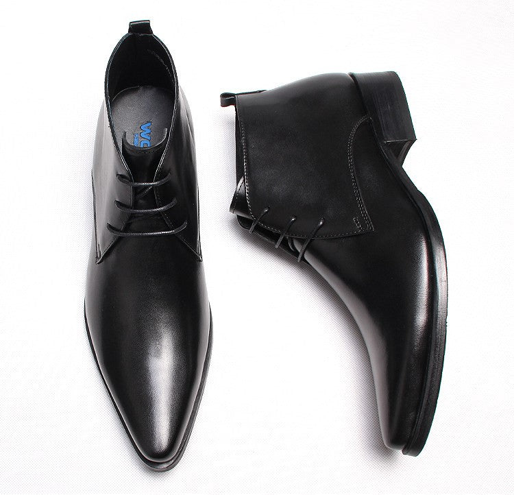 Black leather lace-up dress boots with pointed toe and side pull-tab opening.