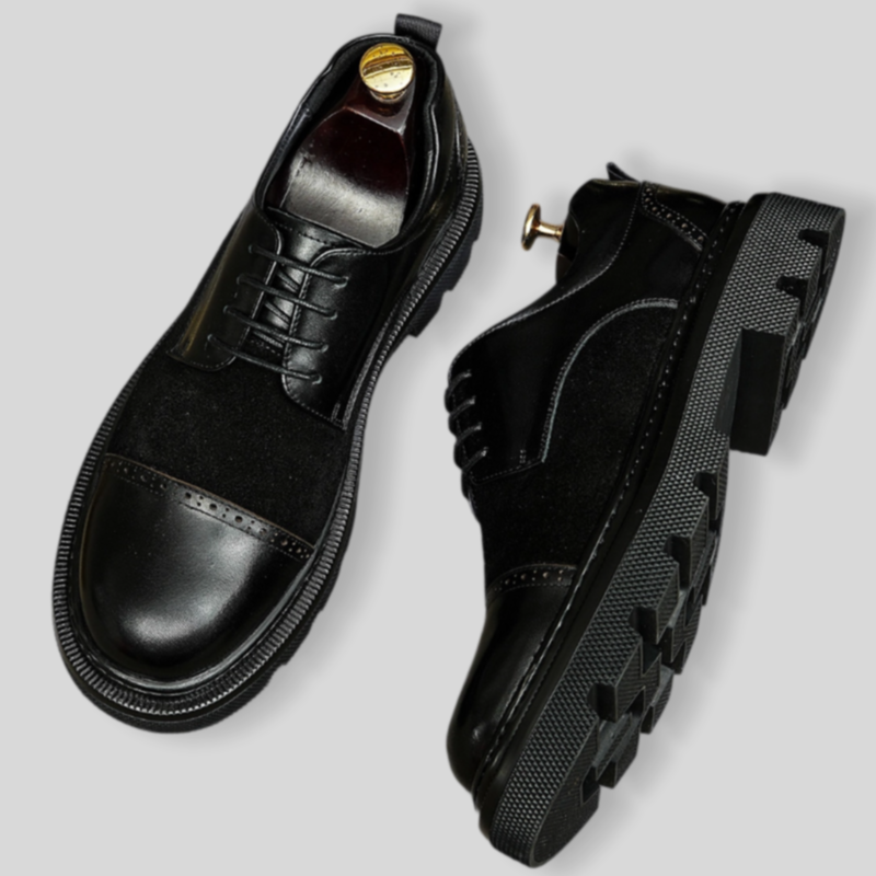 Men's black wingtip brogue oxford shoes with chunky lug sole and lace-up.
