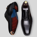 Men's wingtip brogue oxford shoes in black leather, lace-up, chunky lug sole.