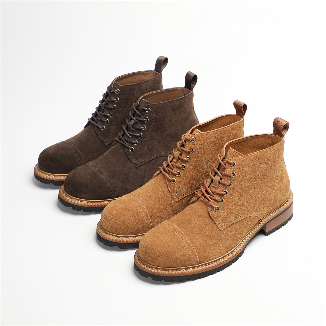 Pair of men's suede chukka boots in dark brown and tan, lace-up with low heel sole