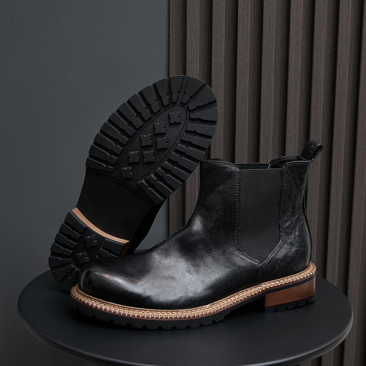 Men's pointed-toe suede Chelsea dress boots, black, outsole view with tread pattern