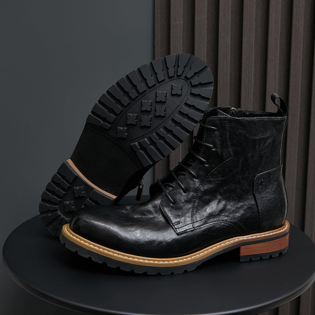 Men's black leather boots with pointed toe, lace-up design, and side zipper.