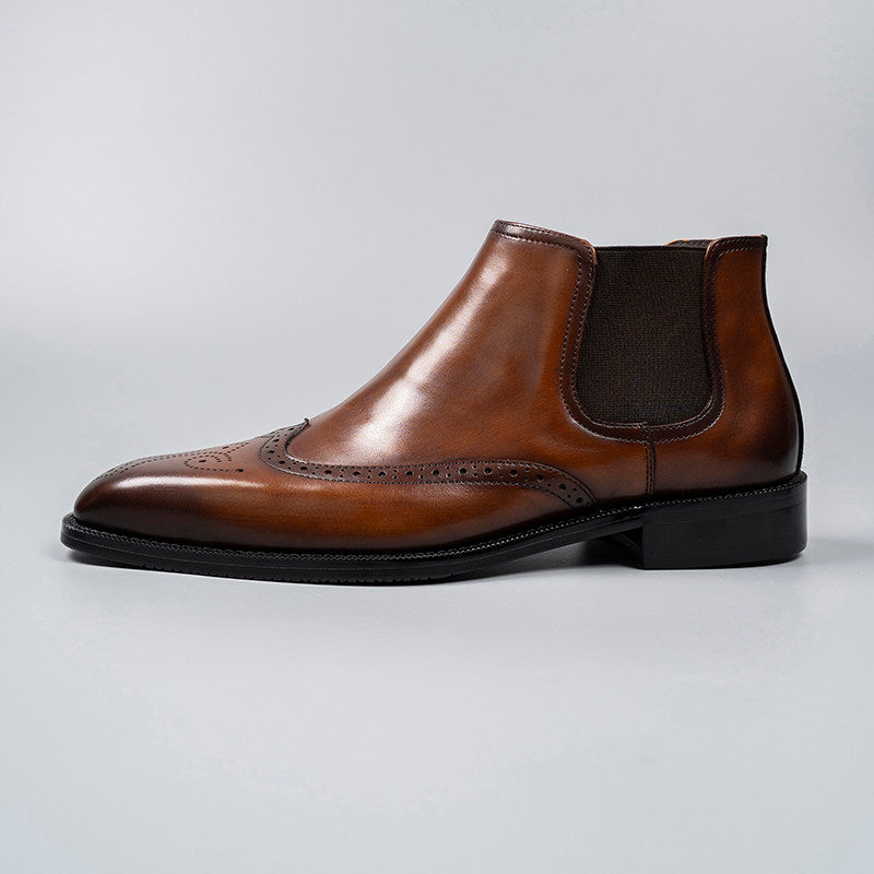 Brown leather Chelsea dress boot with elastic side gore and perforated wingtip detailing