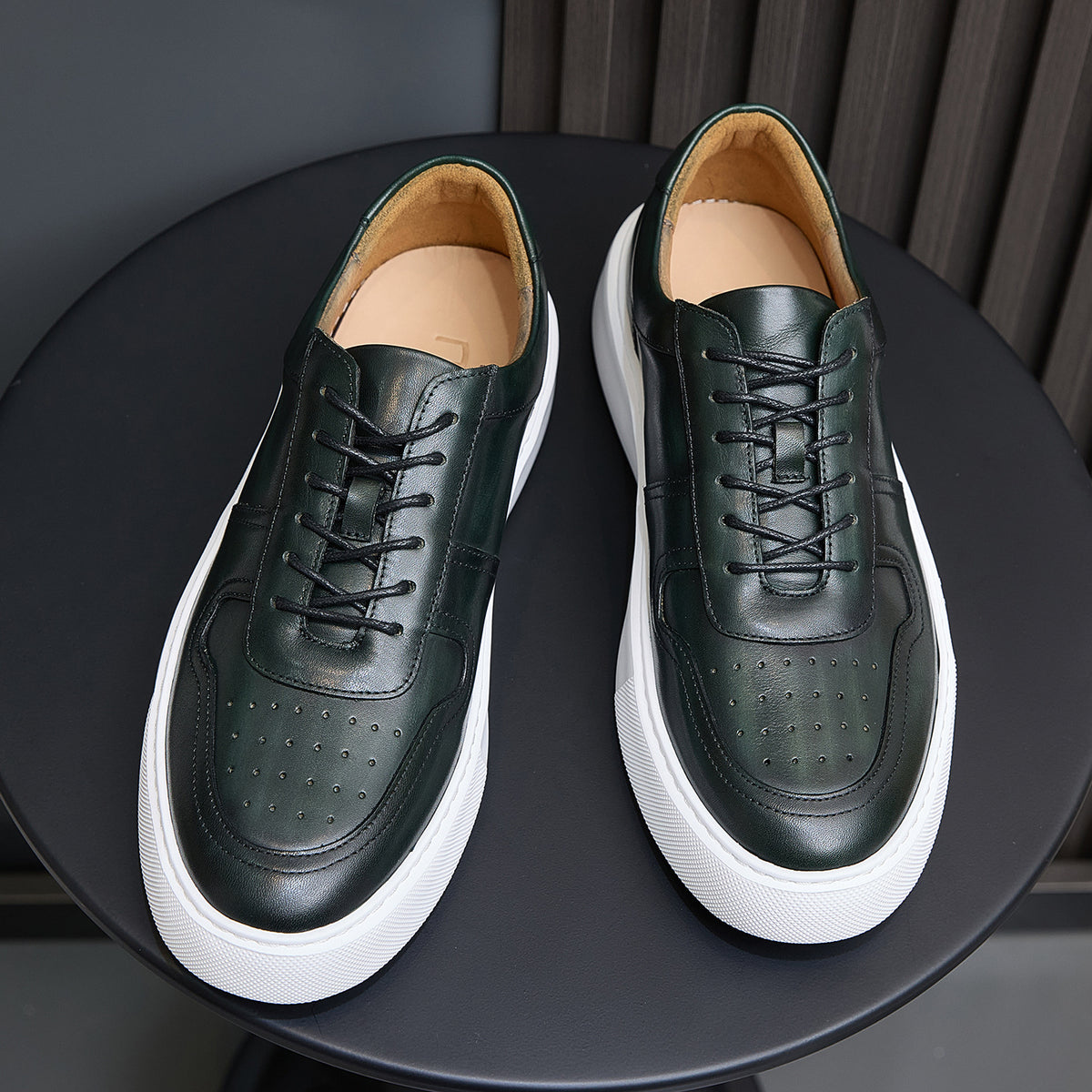 Leather sneakers, dark green, lace-up design with tan lining and white sidewall sole.
