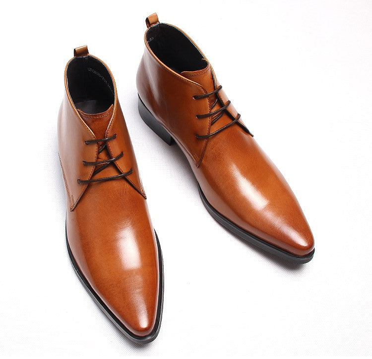 Light brown leather lace-up dress boots with pointed toe and low stacked heel.