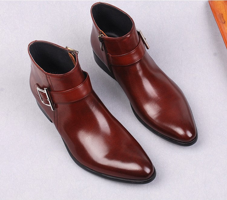 Pair of men's burgundy leather side-zip dress boots with buckle strap, thick sole.