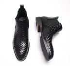 Men's black woven leather slip-on Chelsea boots with elastic side panel and tread sole