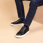 Men's black leather low-top sneakers with laces and white platform sole