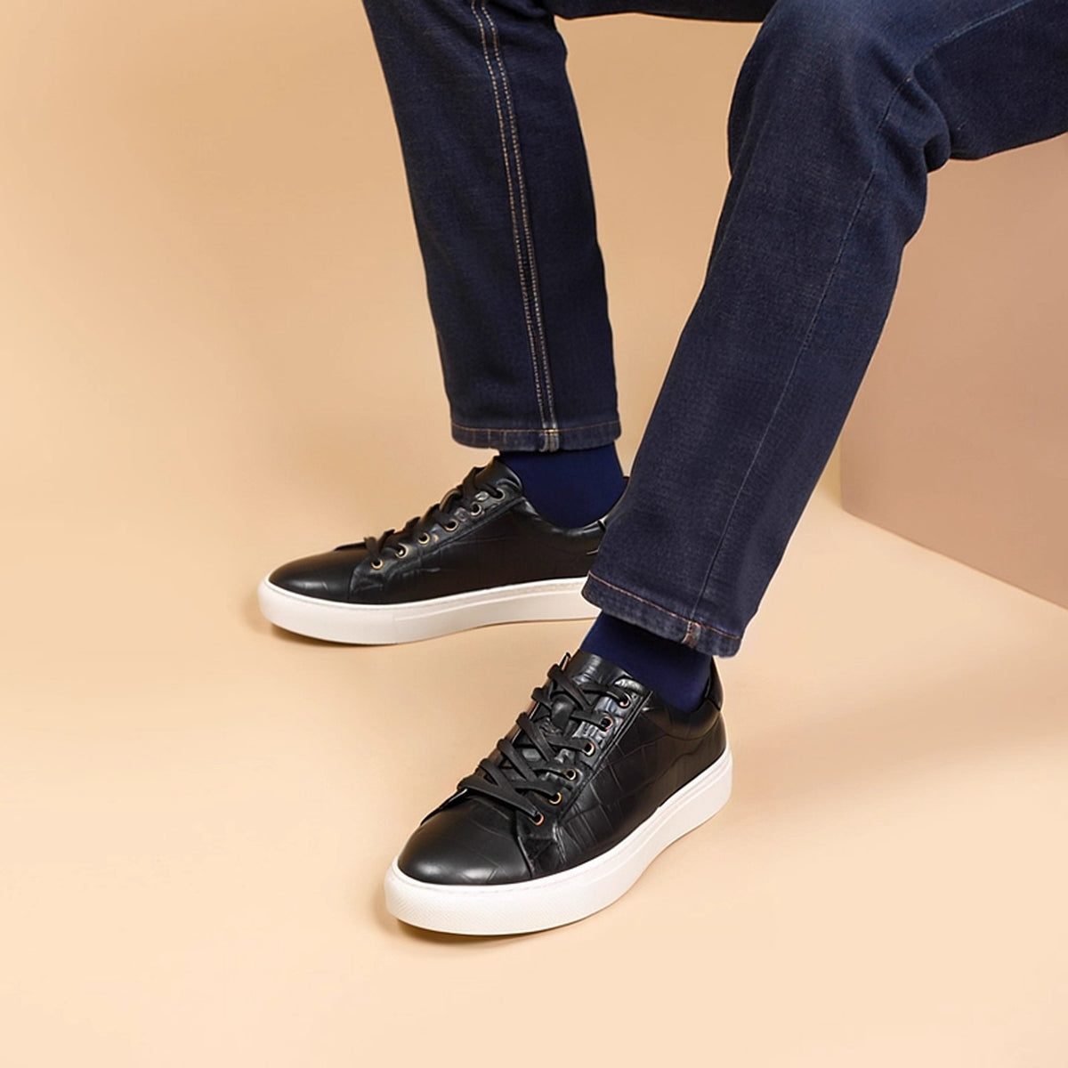 Men's black leather low-top sneakers with laces and white platform sole
