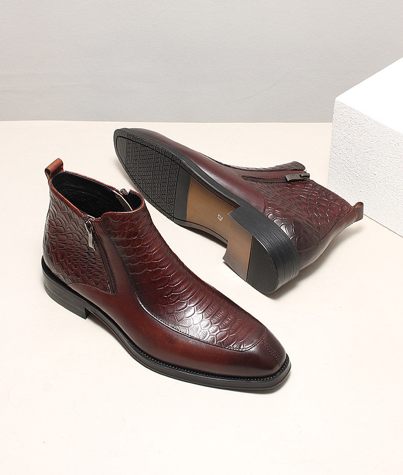 Men's burgundy leather side-zip ankle boots with embossed pattern and chunky sole