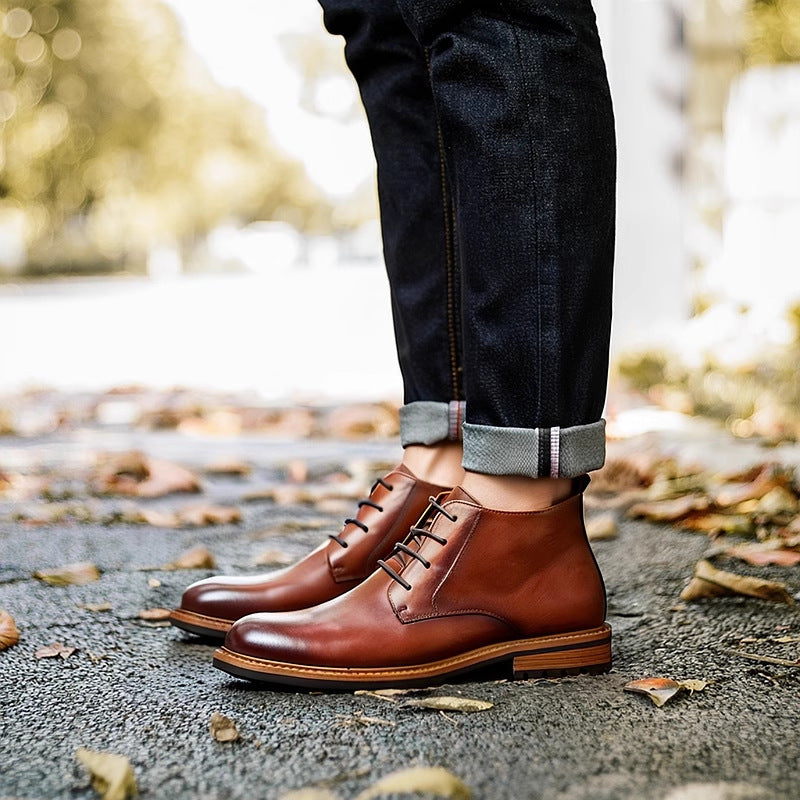 Men's tan-brown leather lace-up chukka boots, plain toe, cuffed jeans