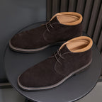 Men's dark brown suede chukka boots with lace-up closure, plain toe, and rubber sole