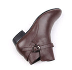 Brown leather pointed-toe ankle boots with side buckle strap, low block heel.