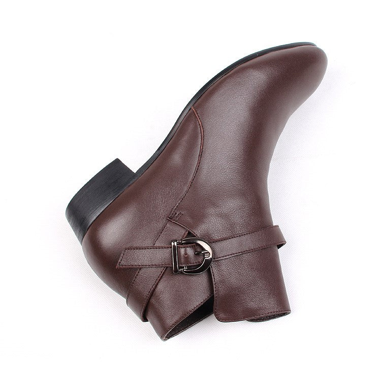 Brown leather pointed-toe ankle boots with side buckle strap, low block heel.