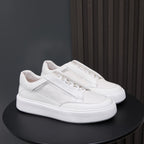 White genuine leather lace-up sneakers with padded collar and textured rubber sole