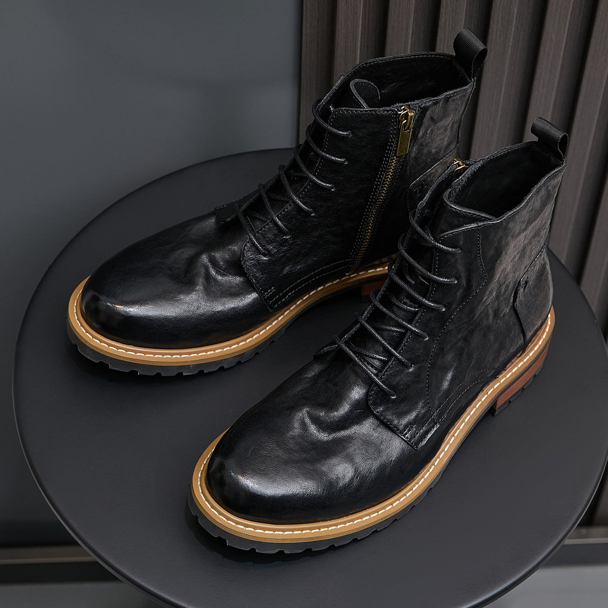 Men's black leather dress boots, lace-up with side zip and pointed toe.