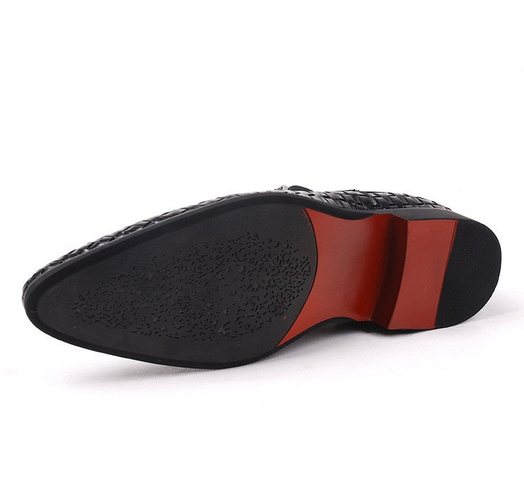 Black leather dress boot sole and heel with thick profile and woven upper