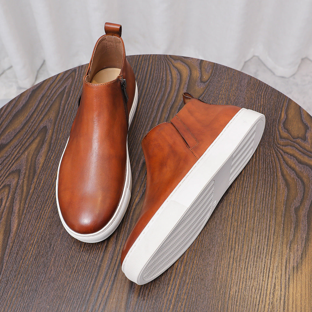 Brown leather side-zip ankle boots with pointed toe and white rubber soles, side angles