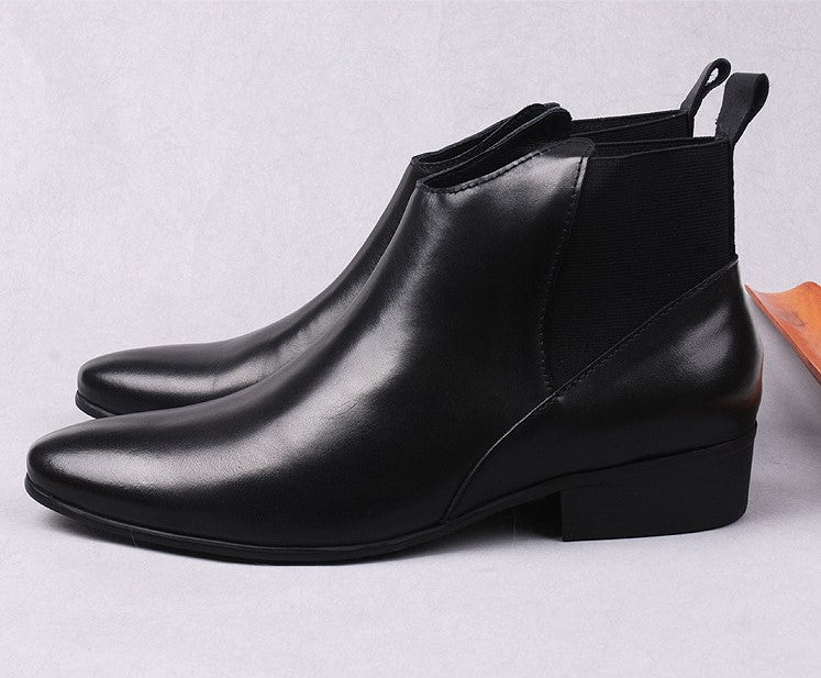 Black leather Chelsea dress boots, side profile with low block heel and pull tab