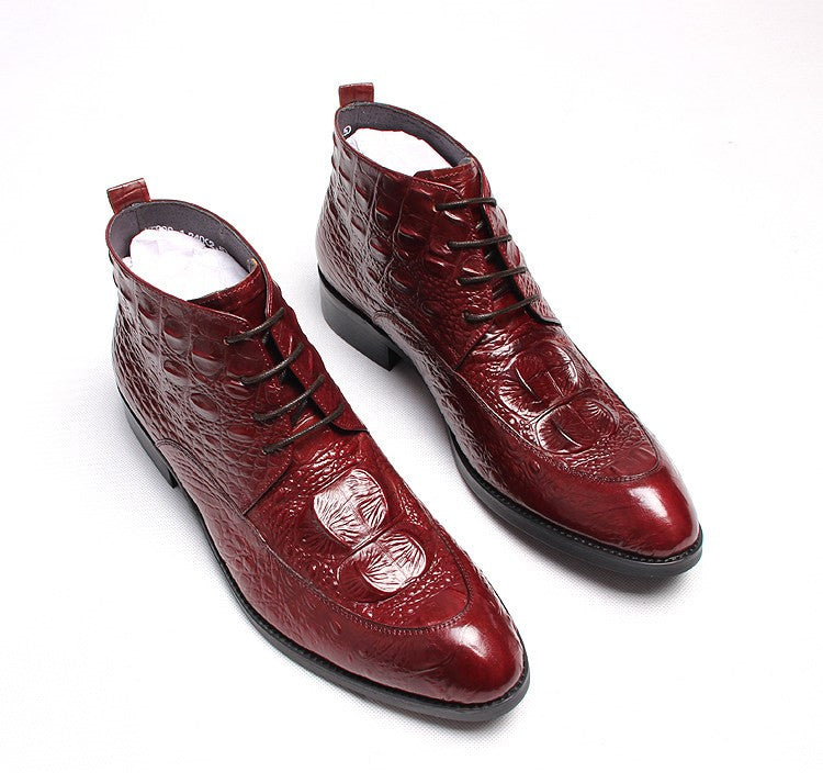 Burgundy lace-up dress boots with wingtip detailing and glossy crocodile-style texture