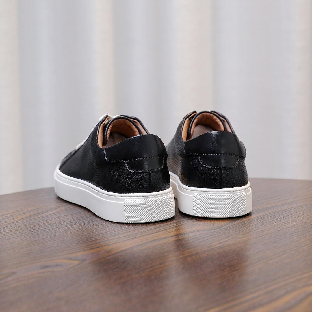 Men's genuine leather sneakers, rear view of black uppers with white soles