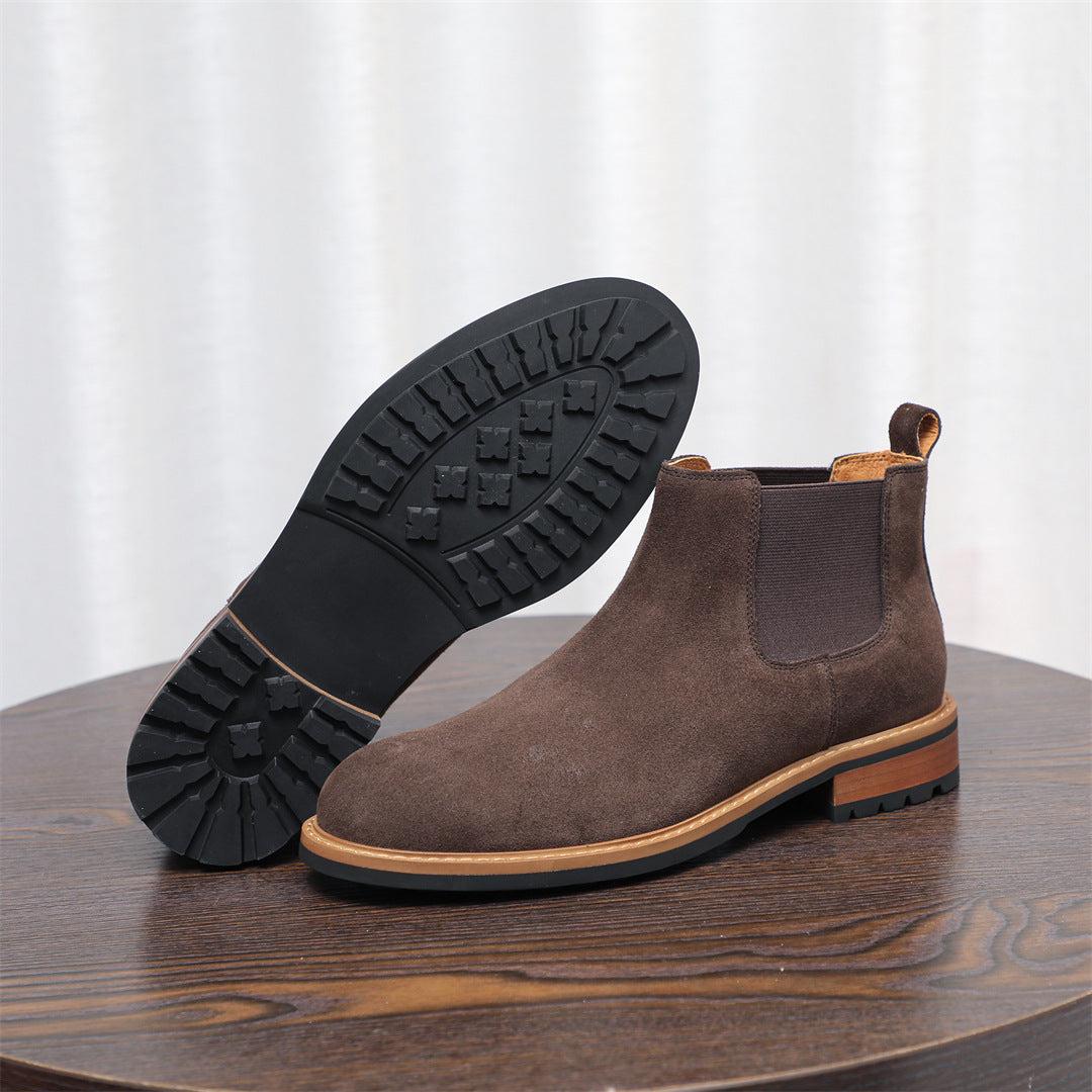 Men's suede chelsea dress boot in dark brown with visible tread outsole and elastic gore