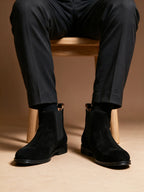 Men's pointed-toe suede Chelsea dress boots, black, worn with rolled trousers