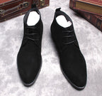 Black suede lace-up dress boots, two-quarter view with open collar and laces