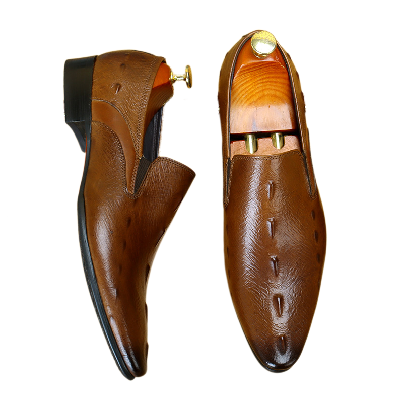 Men's sophisticated brown leather loafers showcasing a luxury croc-embossed texture, perfect slip-on dress shoes for business casual styles.
