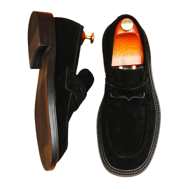 A pair of men's premium black leather loafers, featuring a comfortable slip-on design for a classic and elegant formal dress shoe style.
