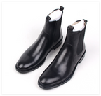 Black leather Chelsea dress boots, slip-on with elastic side panels and low heel