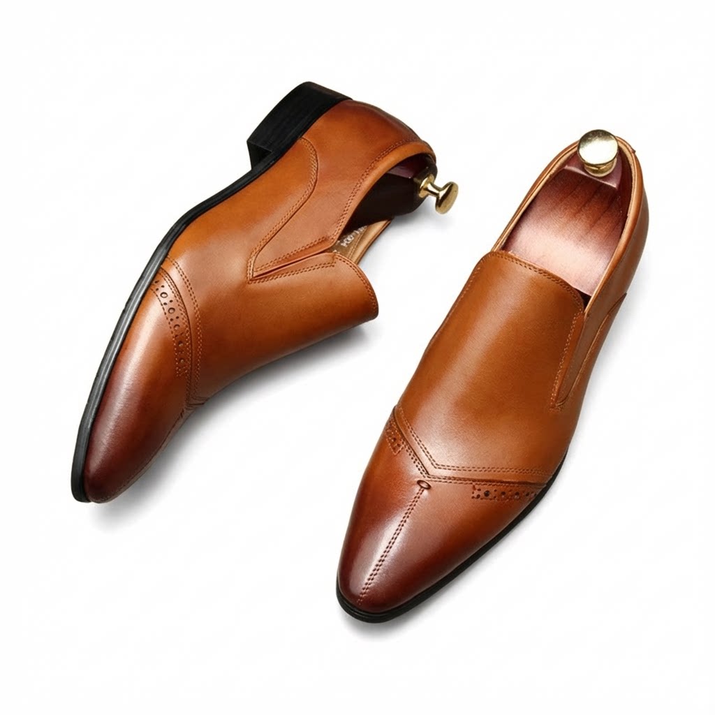 Elegant brown pointed toe leather slip-on dress shoes with a sleek professional silhouette.